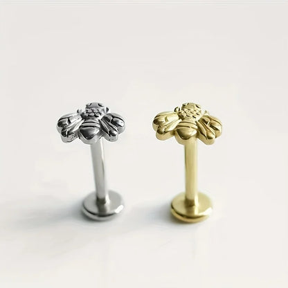 A bee earring for both men and women, with an internal thread, Latin ring, lip stud, ear cartilage, and spiral piercing. It is a